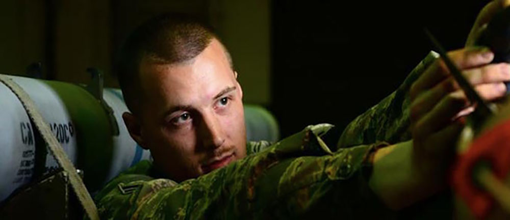 Airman servicing munitions