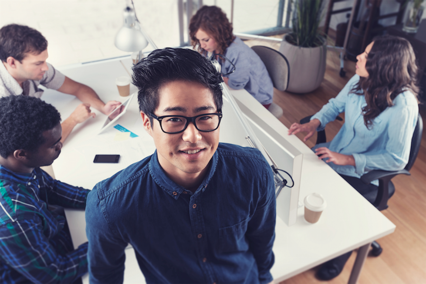 Group of people working together around a table