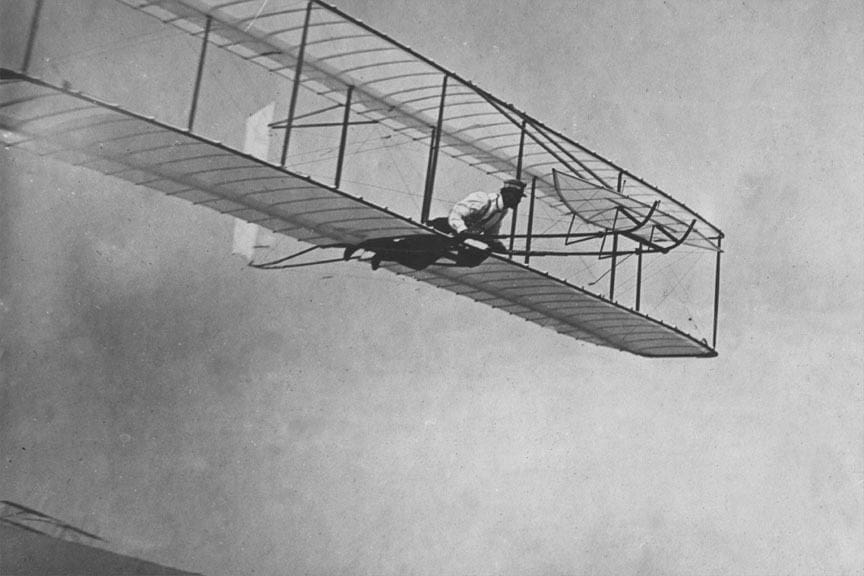 The Wright Brothers making their first growing glider flight.