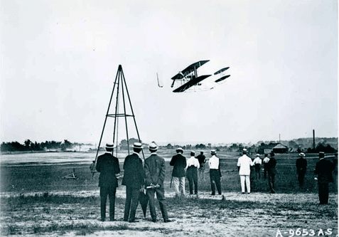 The world's first manned, powered, sustained, and controlled flight by a heavier-than-air vehicle.