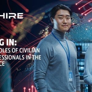 Aim Hire Episode 14: Logging In: The Many Roles of Civilian Cyber Professionals in the U.S. Air Force. A woman and a man wearing badges, smiling.