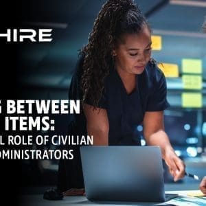 Aim Hire Episode 18: Reading Between the Line Items, A woman and a man looking over documents together.